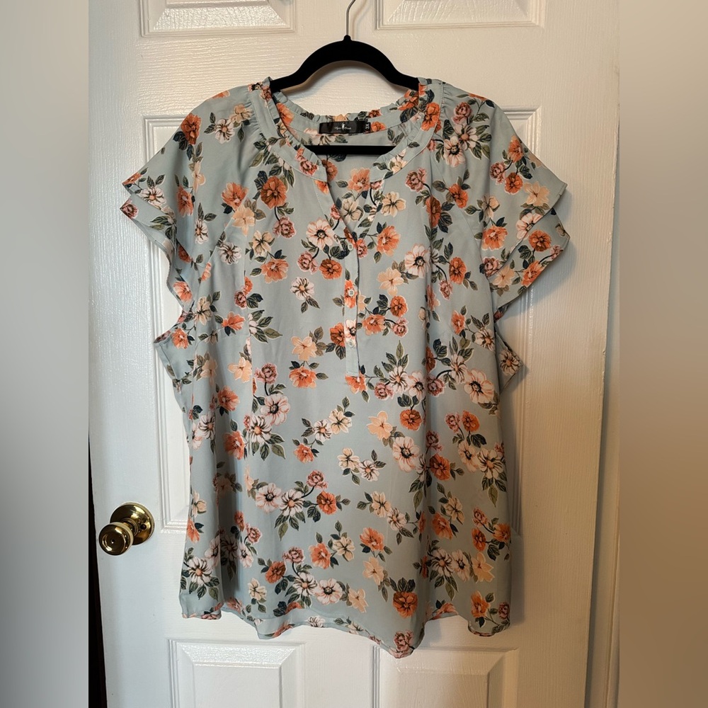 Light blue and orange floral cap sleeves blouse